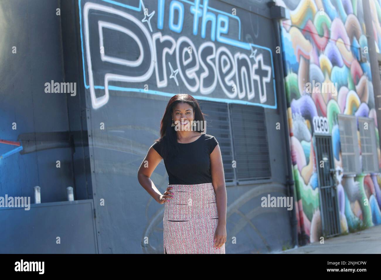 Tyra Fennell, Imprint City founder and CEO, stands for a portrait on Egbert Street in front of