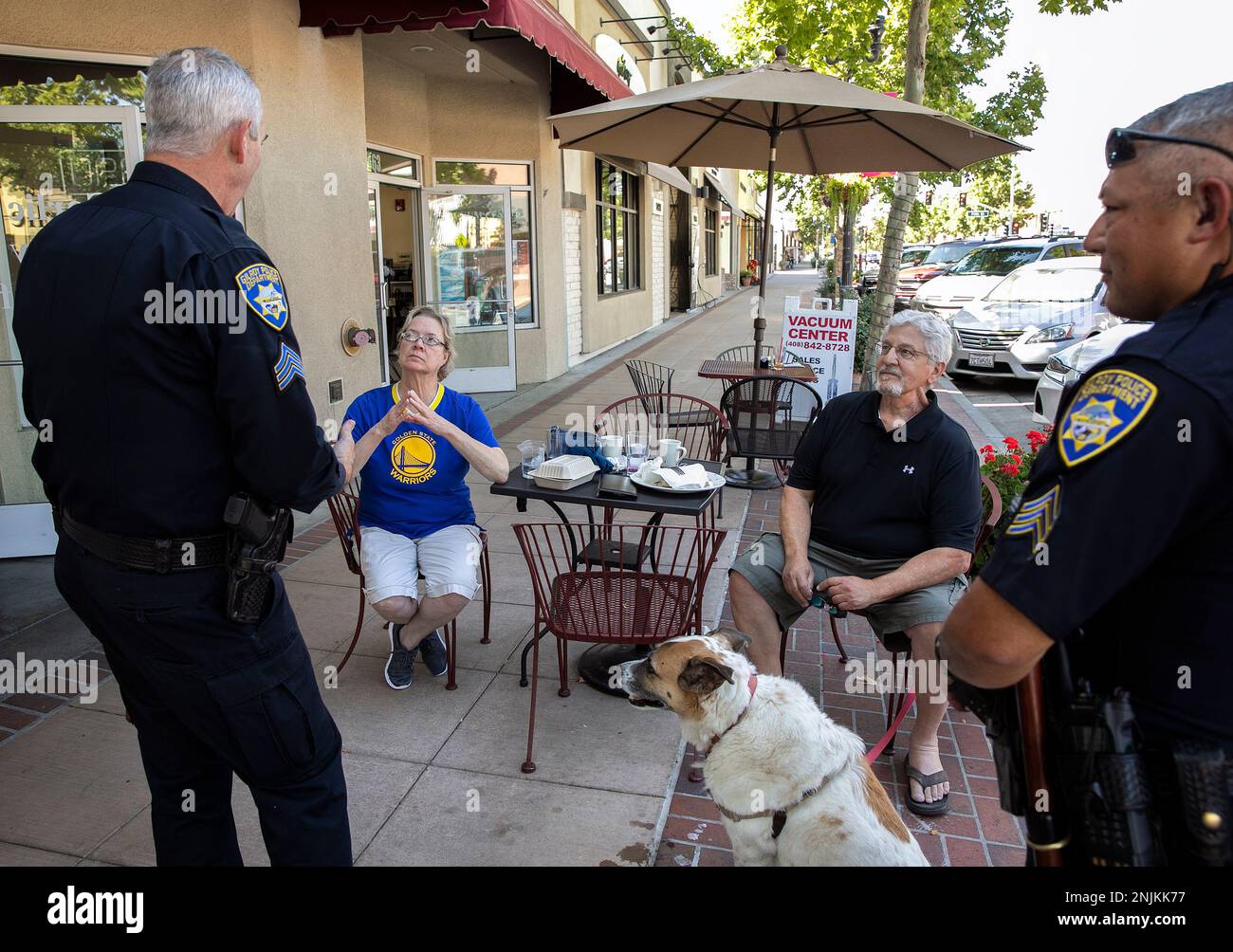 From center left, Judy Walko, her husband Bob Goldman, and their dog