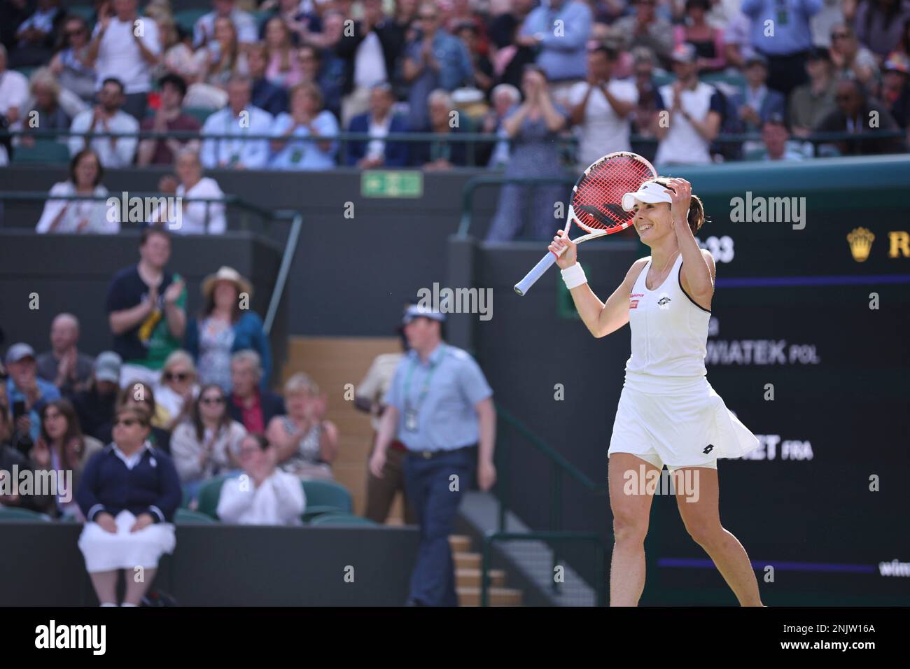 Alizé (R) of France and Iga Swiatek of Poland praise their game