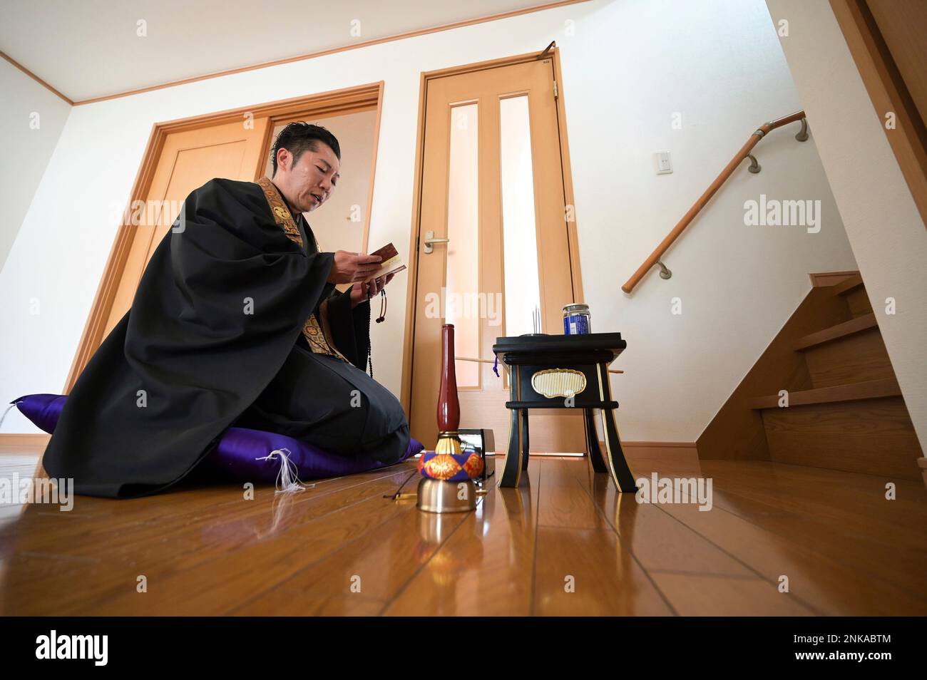 A Buddhist holds a religious service before handing over the real