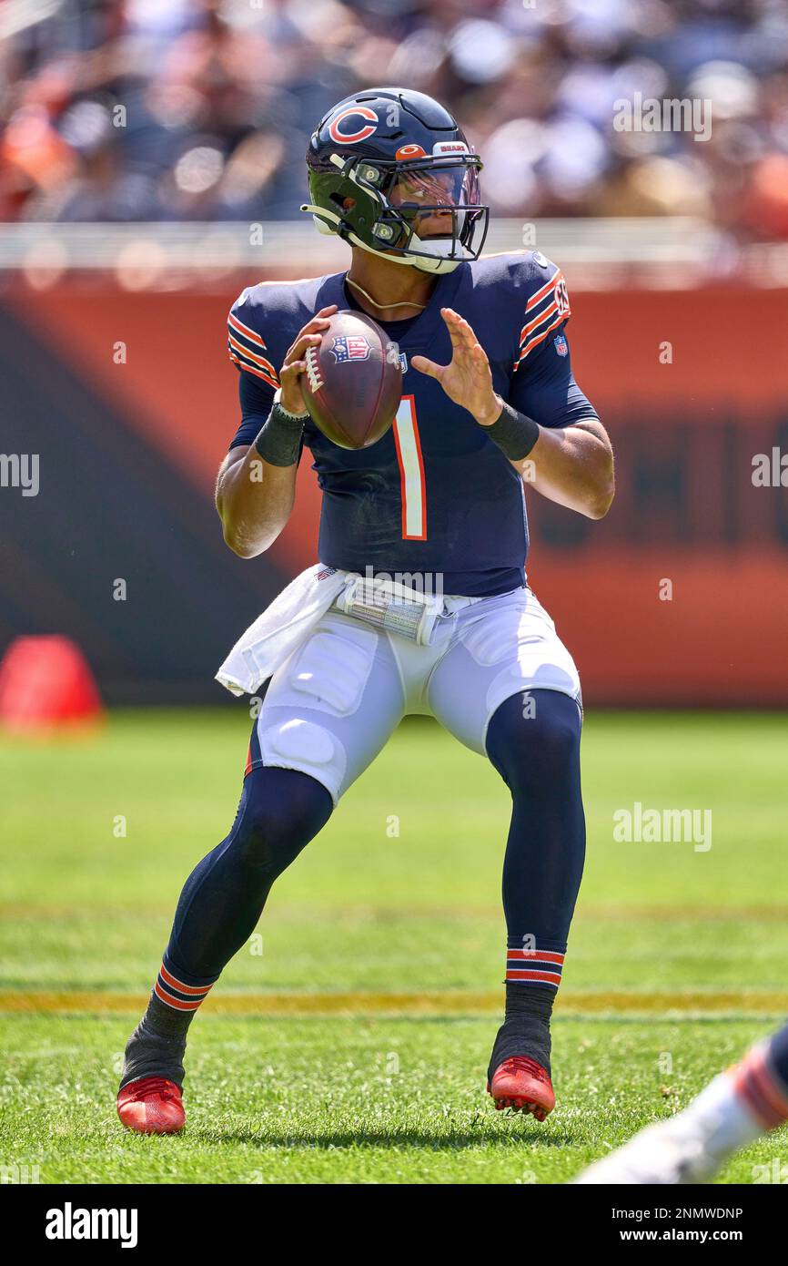 CHICAGO, IL - AUGUST 14: Miami Dolphins quarterback Tua Tagovailoa (1)  throws the football in warmups during a preseason game between the Chicago  Bears and the Miami Dolphins on August 14, 2021