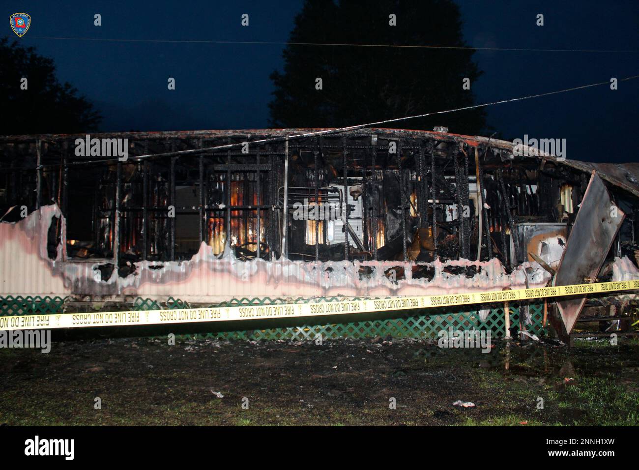 This photo provided by Louisiana State Fire Marshal’s Office shows mobile home that was set on
