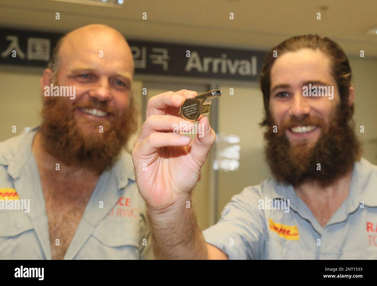 Ron Rutland (L) and James Owen carrying the World Cup Rugby referee's