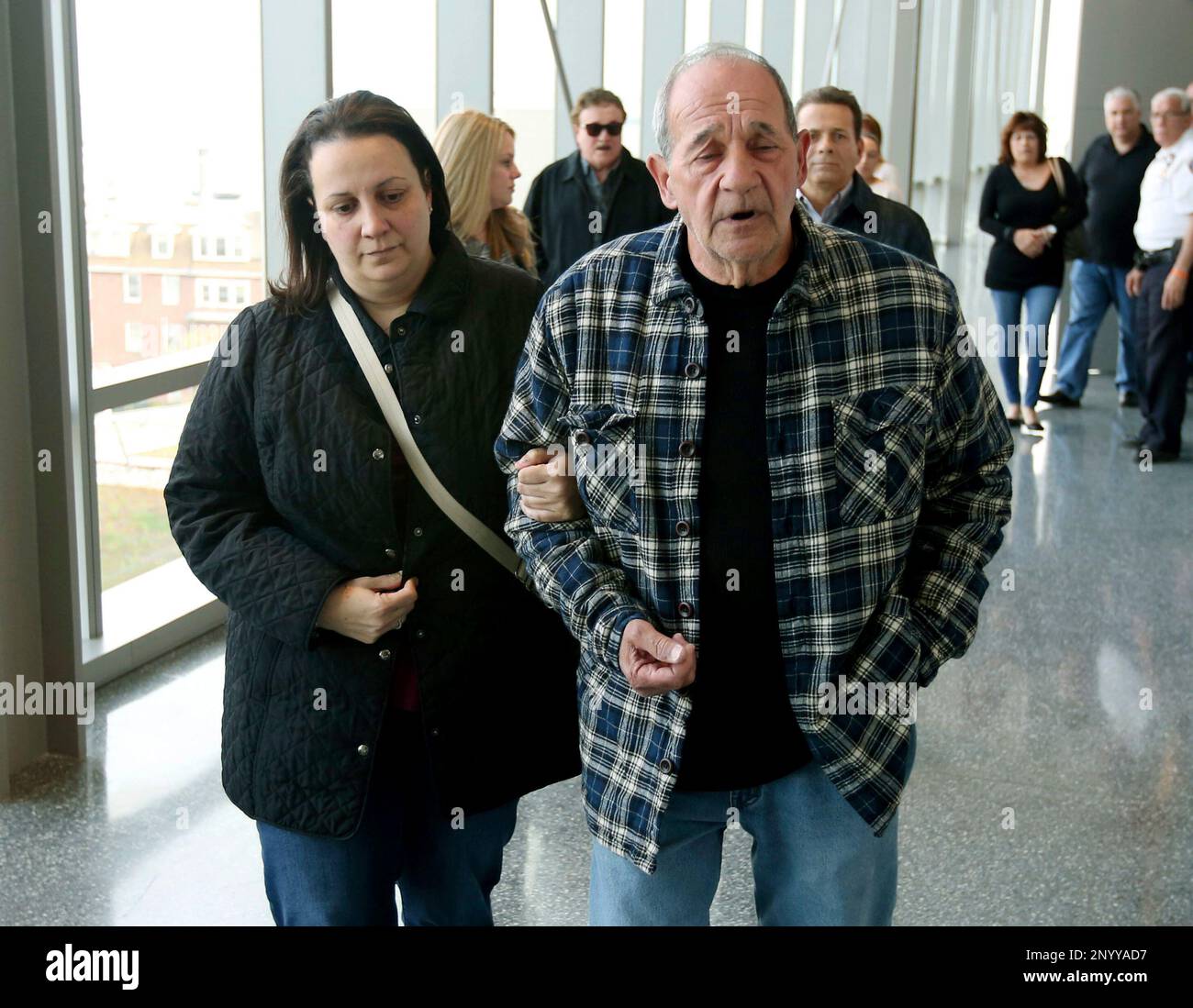 In this Thursday, May 4, 2017 photo, Roseann Rodriguez and Angelo Rodriguiez, the sister and father of the deceased Joseph Rodriguez, walk inside the Richmond Supreme Courthouse, in Staten Island, N.Y. Former New Jersey police officer Pedro Abad was convicted Thursday in a wrong-way crash that killed a fellow officer and Rodriguez in what prosecutors said was the result of extreme intoxication. (Ed Murray/NJ Advance Media via AP) Foto de stock