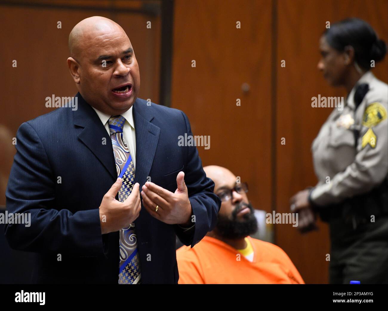 Attorney Matthew Fletcher, left, speaks for his client, Marion "Suge