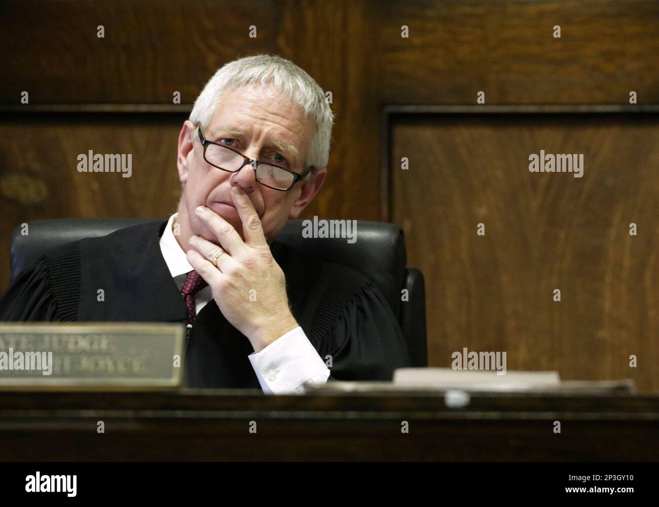 Cook County Judge Timothy Joyce looks out over the courtroom during the