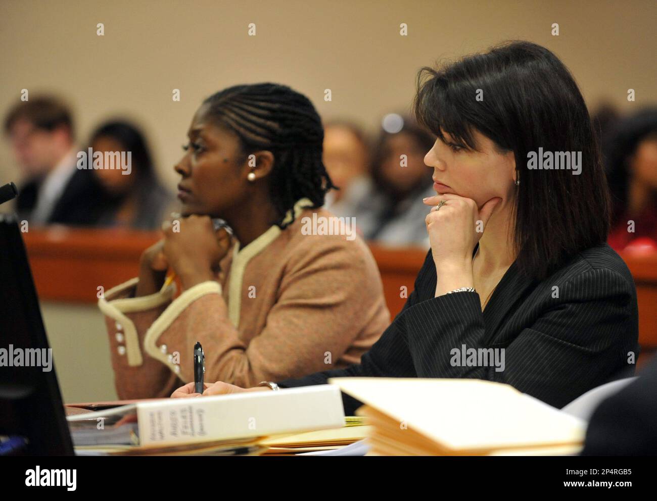 Dekalb prosecutors Lawanda Hodges, left, and Anna Cross listen to