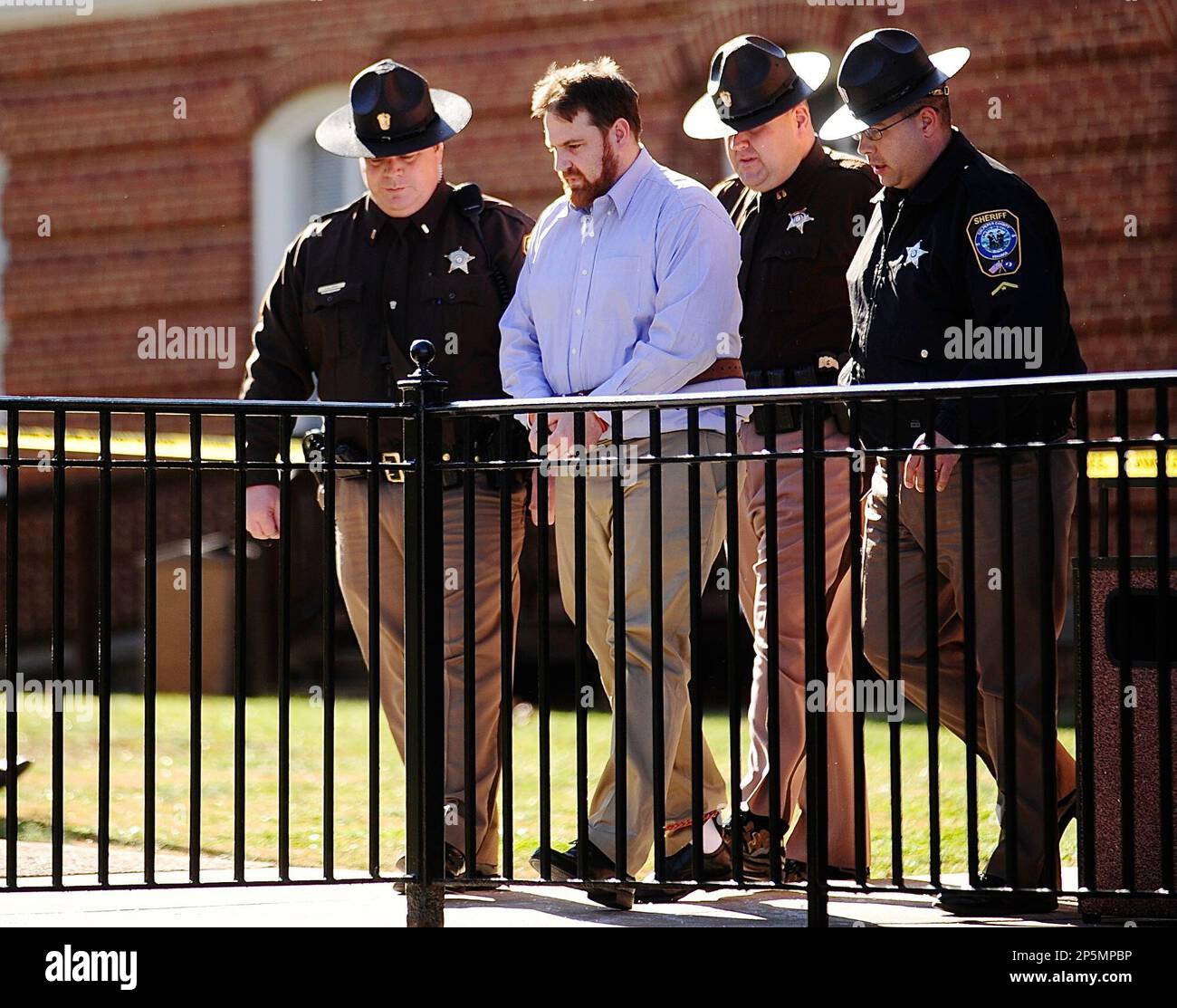 Daniel HarmonWright is escorted to the Culpeper County Jail by