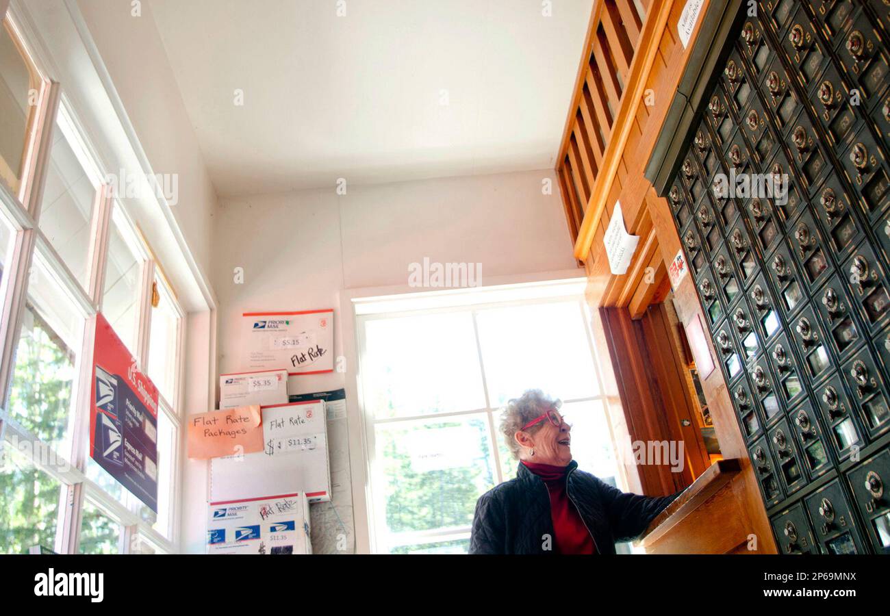 Glacier National Park resident Mary Grace Galvin drops mail off at the