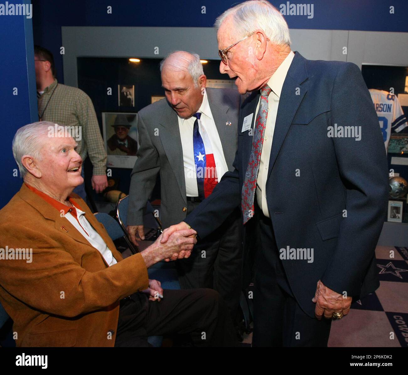 former-texas-football-coach-darrell-royal-left-shakes-hands-with-g-a
