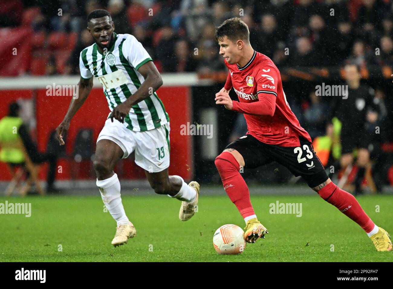 Palko Dardai of MOL Fehervar FC challenges Anderson Esiti of