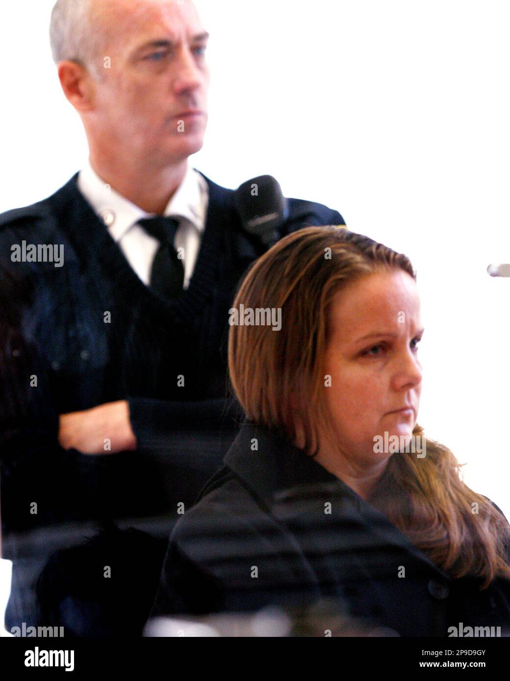 Deborah Girouard listens to evidence described by the district attorney