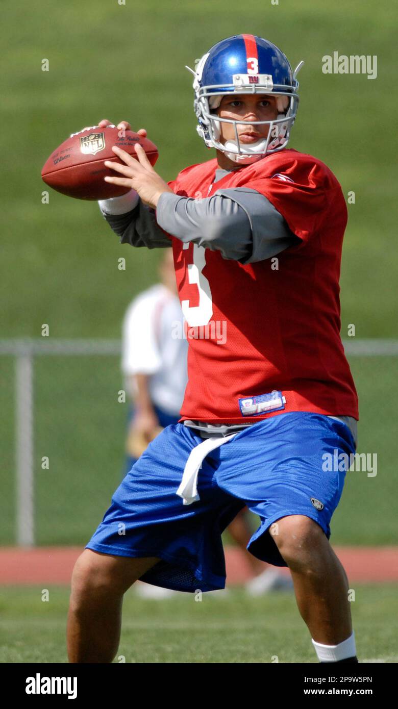New York Giants quarterback Andre Woodson passes the ball at the Giants