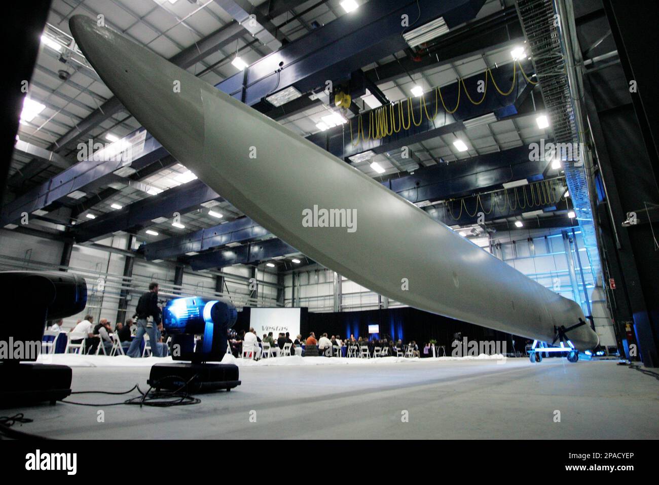 A wind turbine blade is unveiled during the opening of the Vestas blade