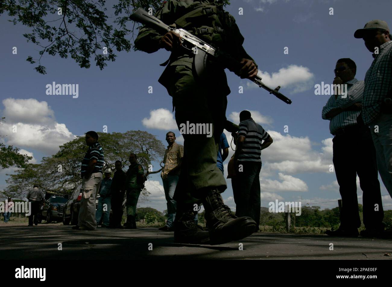 Venezuelan soldiers patrol near the site where rancher Eustacio Galindo