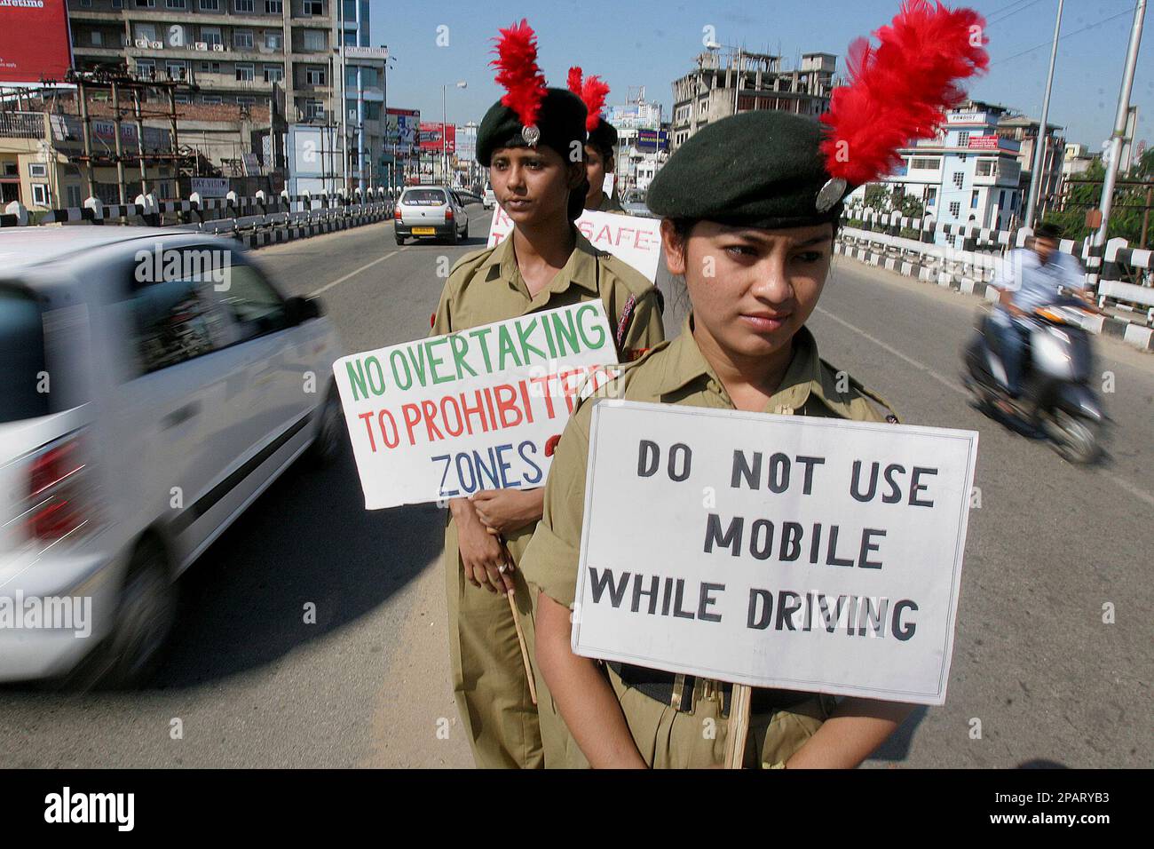 National Cadet Corps (NCC) cadets stand with placards on a road divider