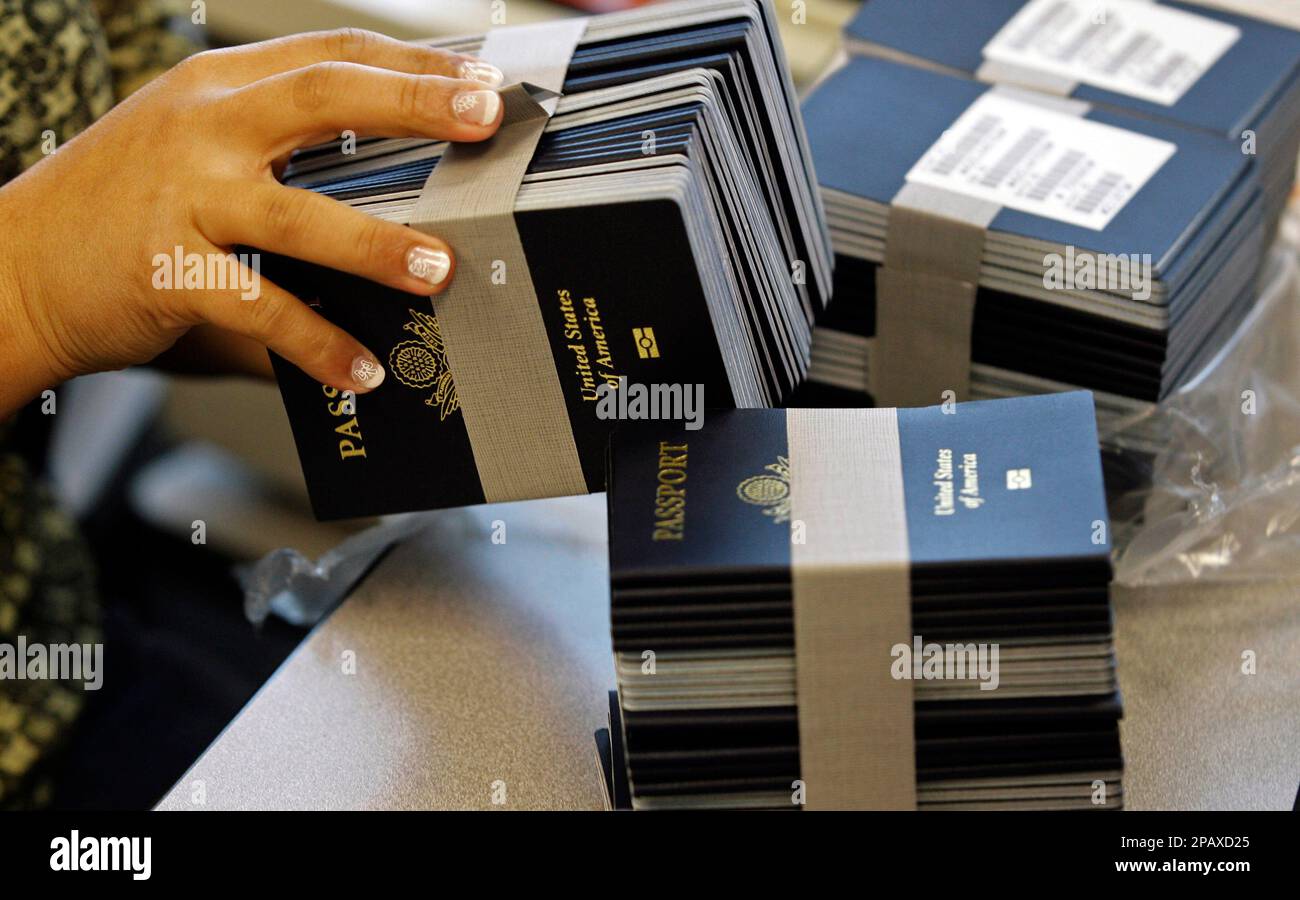 ** FILE ** Stacks of passport books are seen at the New Orleans Passport Agency in New Orleans