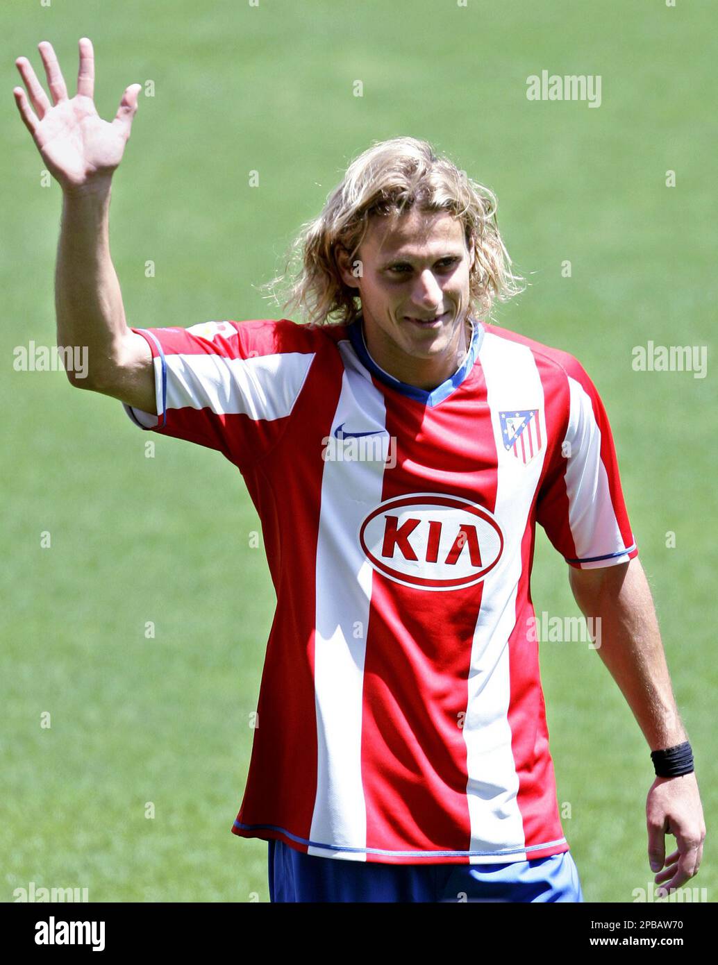 Diego Forlan of Uruguay waves to fans during his official presentation for Atletico  Madrid at the Vicente Calderon stadium in Madrid, Tuesday July 17, 2007.  Forlan previously played for Villarreal, Manchester United