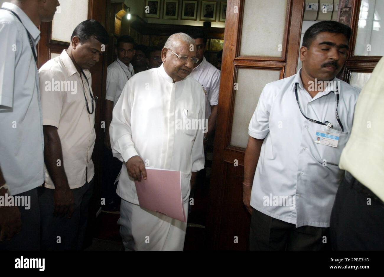 Sri Lankan Prime Minister Ratnasiri Wickramanayake, center, leaves