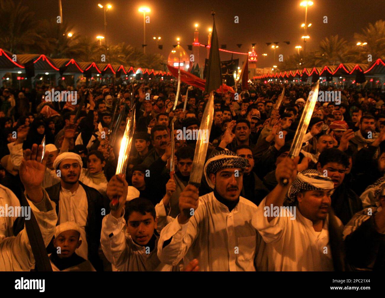 Iraqi pilgrims reenact the Battle of Karbala during Muharram, an