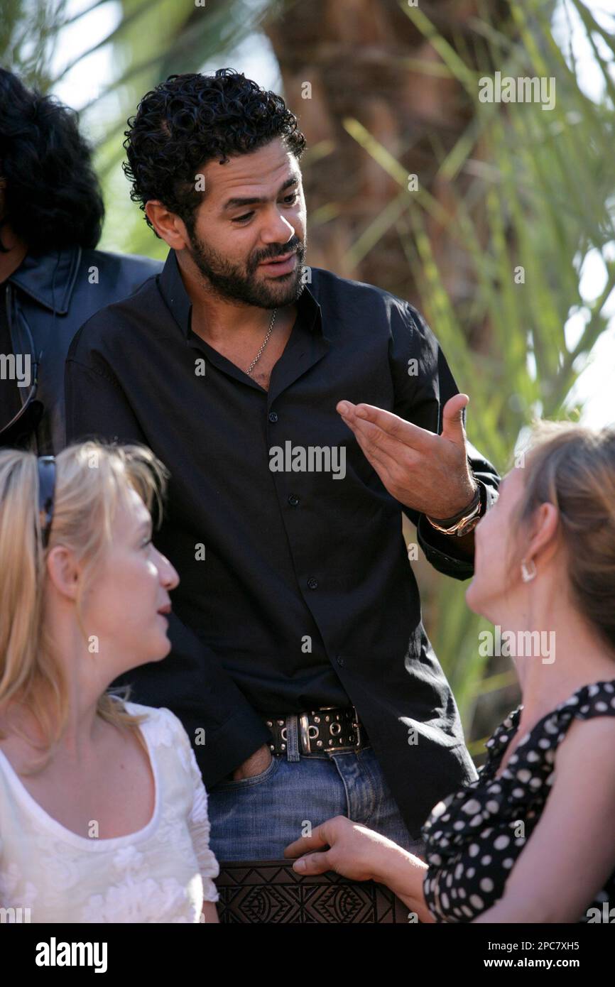 Moroccanborn filmmaker and French actor Jamel Debbouze, center, talks