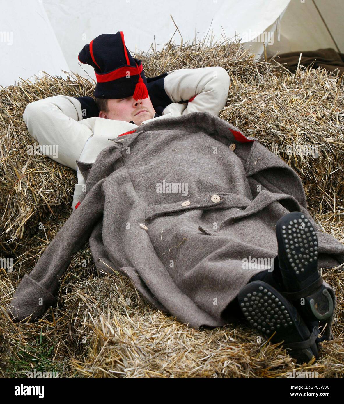 A French actor takes a break during preparations for the reconstruction