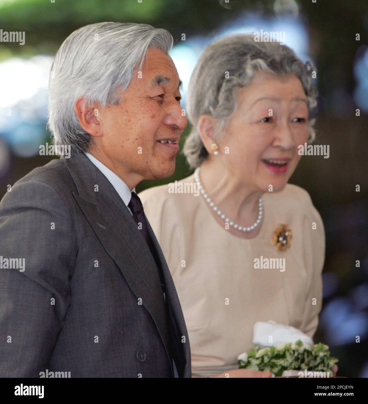 Japan's Emperor Akihito, left, and Empress Michiko arrive at Aiiku