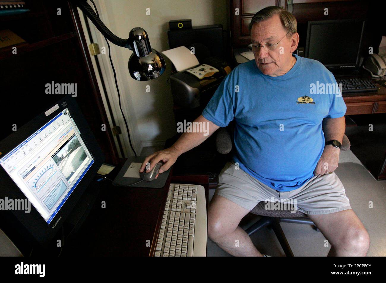 Dick Becker, president of the Richland Park Estates Homeowners Association looks at one of the