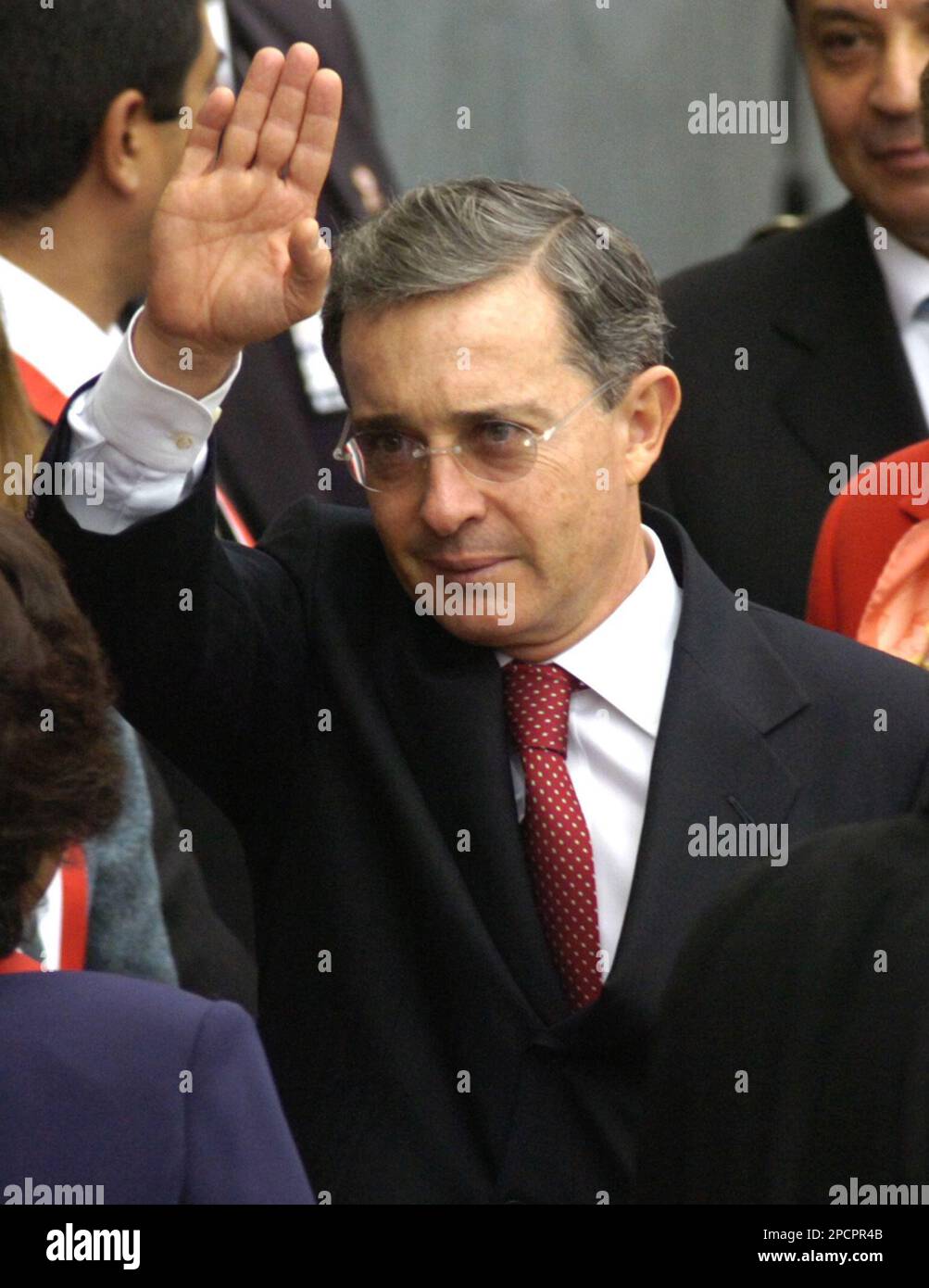 Colombia's President Alvaro Uribe, greets the media before the swearing