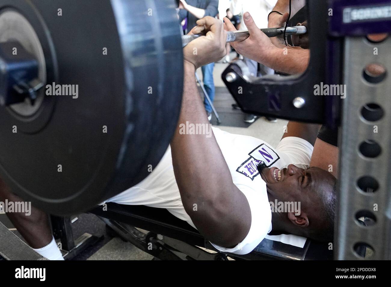 Northwestern defensive line Adetomiwa Adebawore reacts as he bench