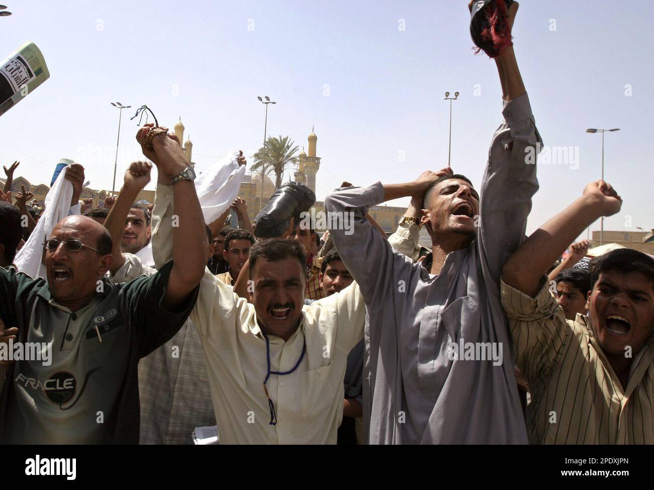 Iraqis chant slogans against the proposed division of Iraq demanding a  centralized form of government in the Shiite district of Khadmiya in  Baghdad, Friday, Aug. 19, 2005. Several thousand people demonstrated against