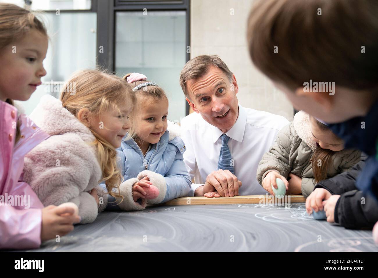 Britain's Chancellor of the Exchequer Jeremy Hunt, meets children