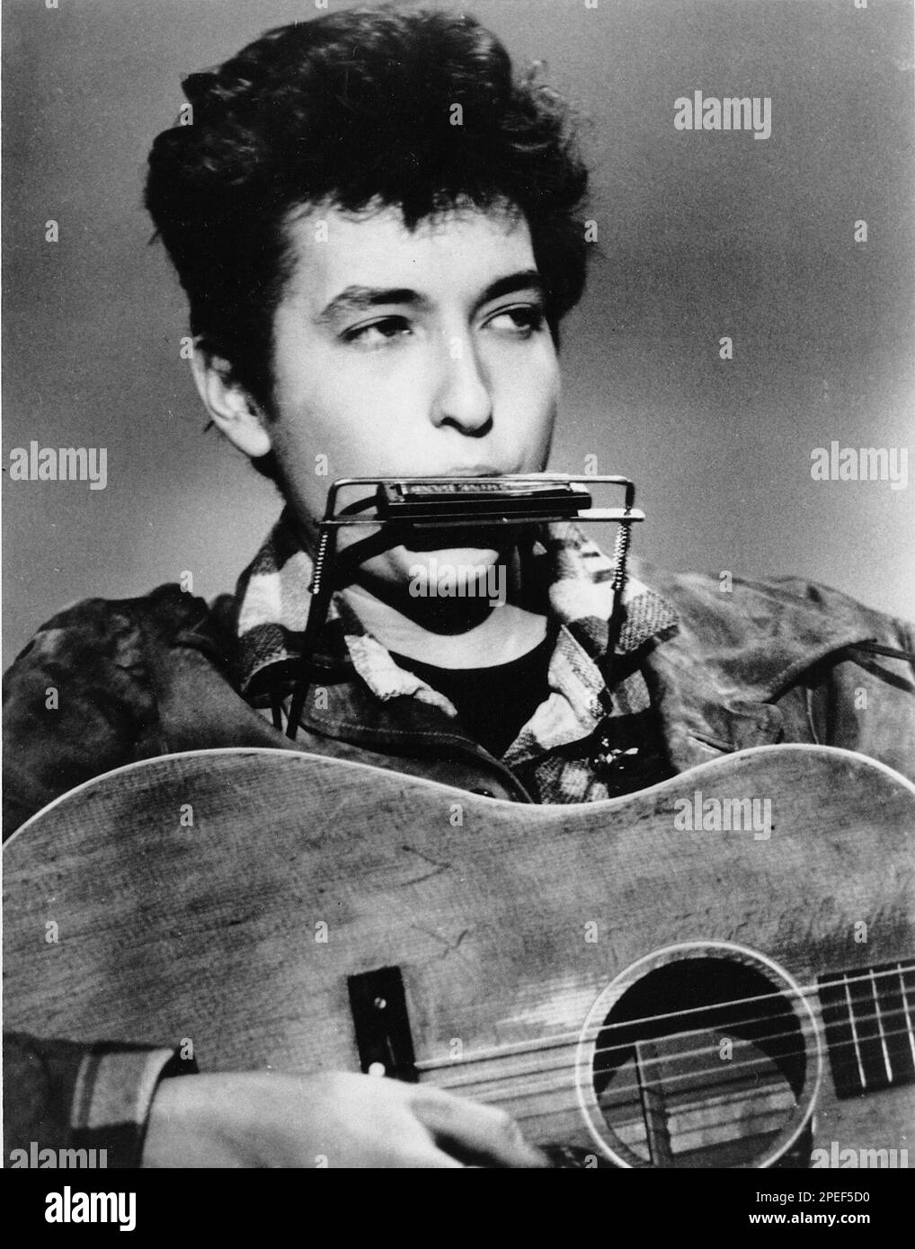 **FILE**Folk singer and songwriter Bob Dylan plays the harmonica and