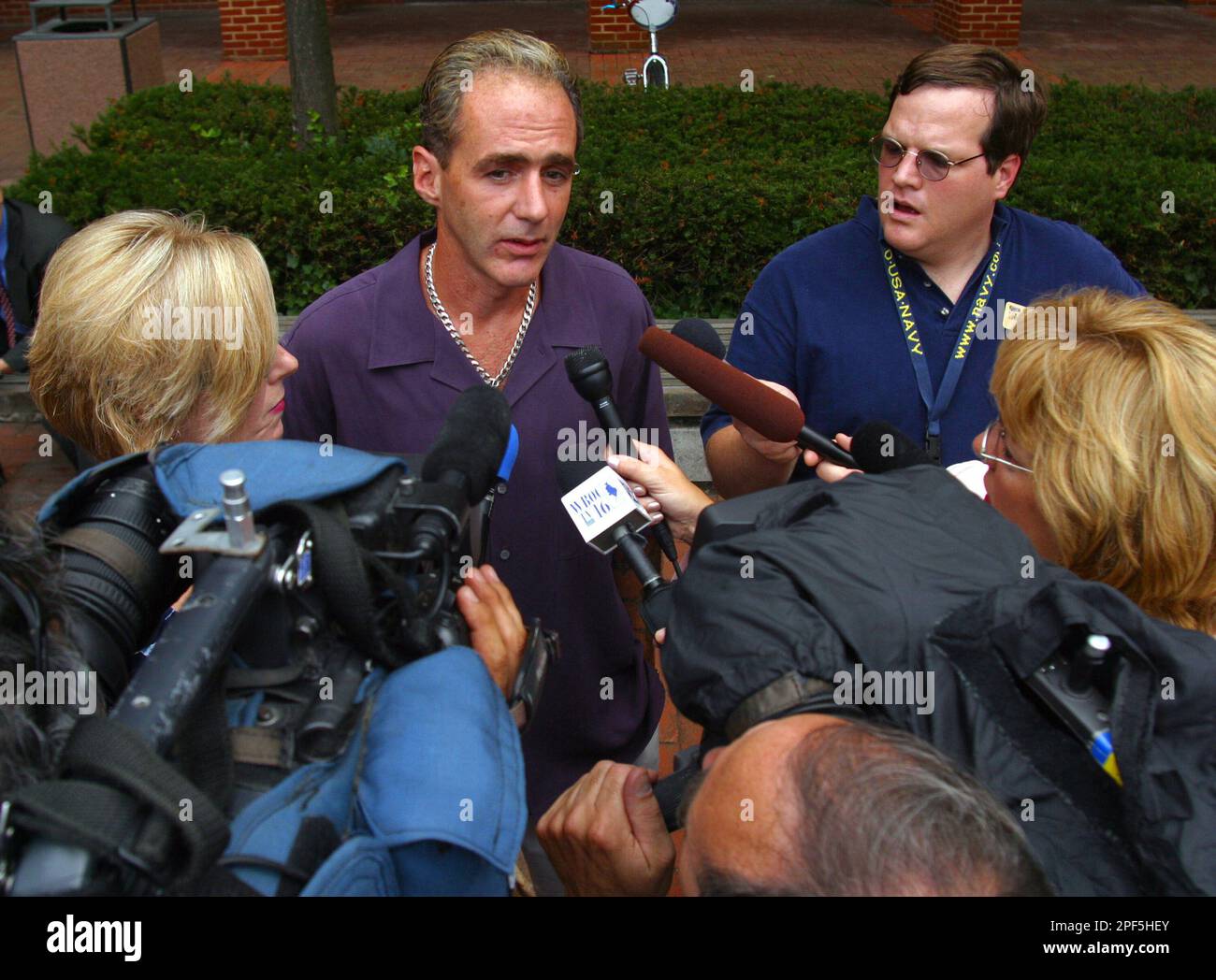 Mark Ford, left, brother of murder victim Joshua Ford, speaks to