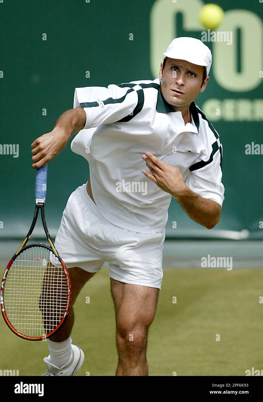 French tennis player Fabrice Santoro returns a ball during his second round  match against Karol Kucera from Slovakia at the ATP Gerry Weber Open tennis  tournament in Halle, western Germany, Thursday, June
