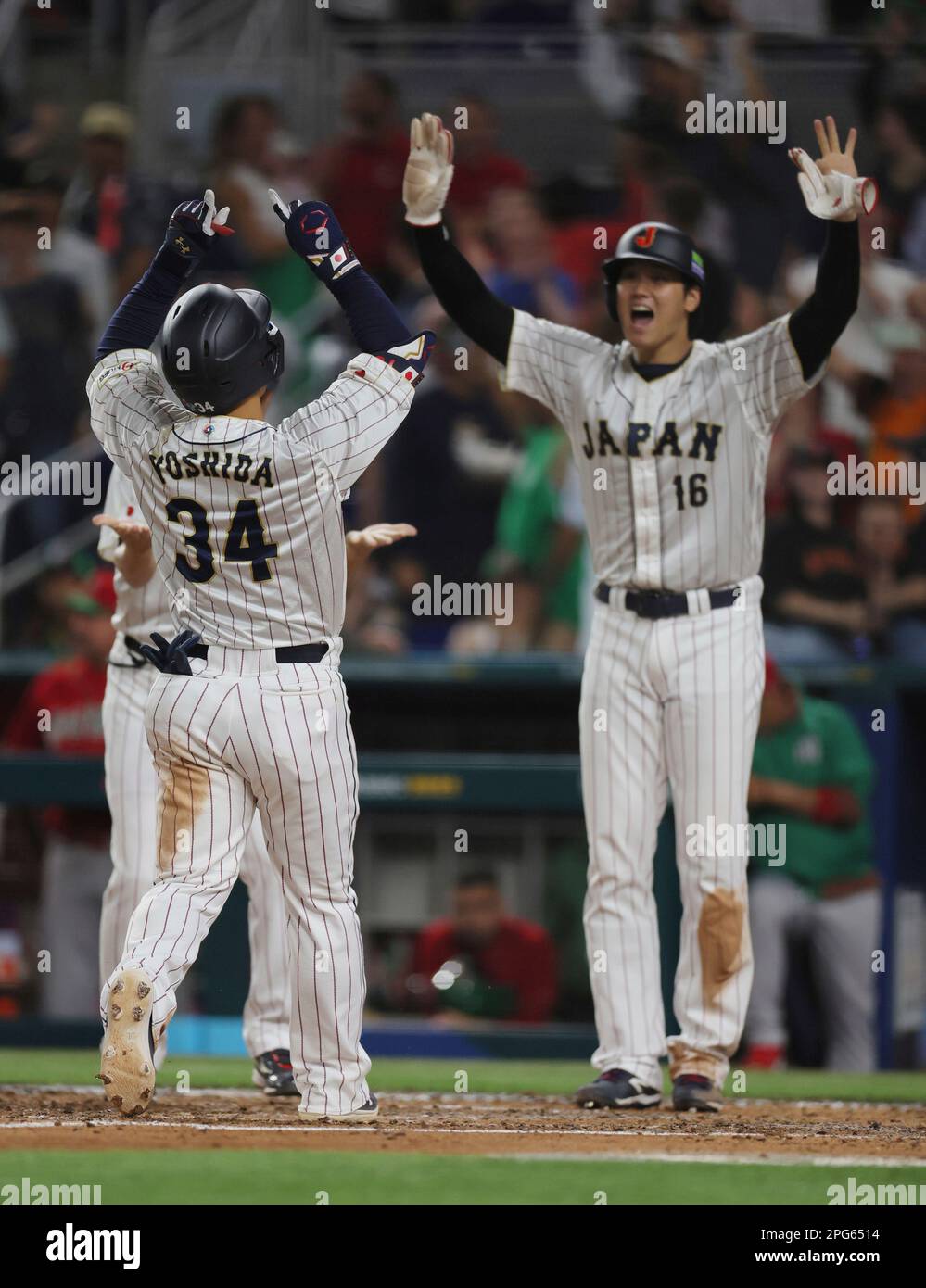 Masataka Yoshida of Japan (34) hits threerun homer in the 7th inning