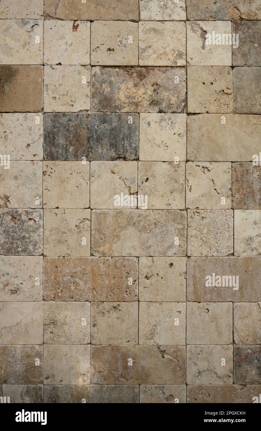 Marrón cuadrado pared de piedra de fondo de azulejos de cerca de la vista Foto de stock