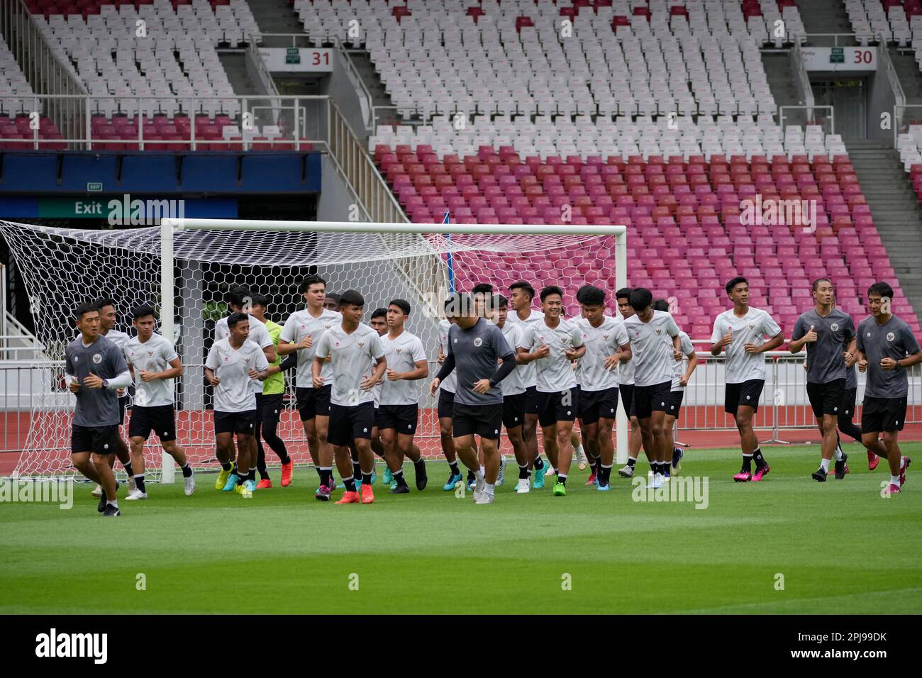 Members of Indonesian U20 national soccer team run at Gelora Bung
