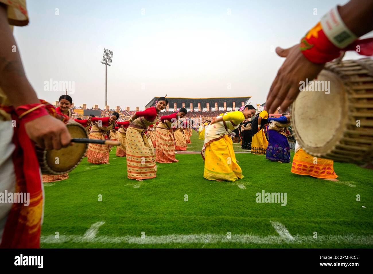 Assamese dancers in traditional attire perform as they attempt Guinness