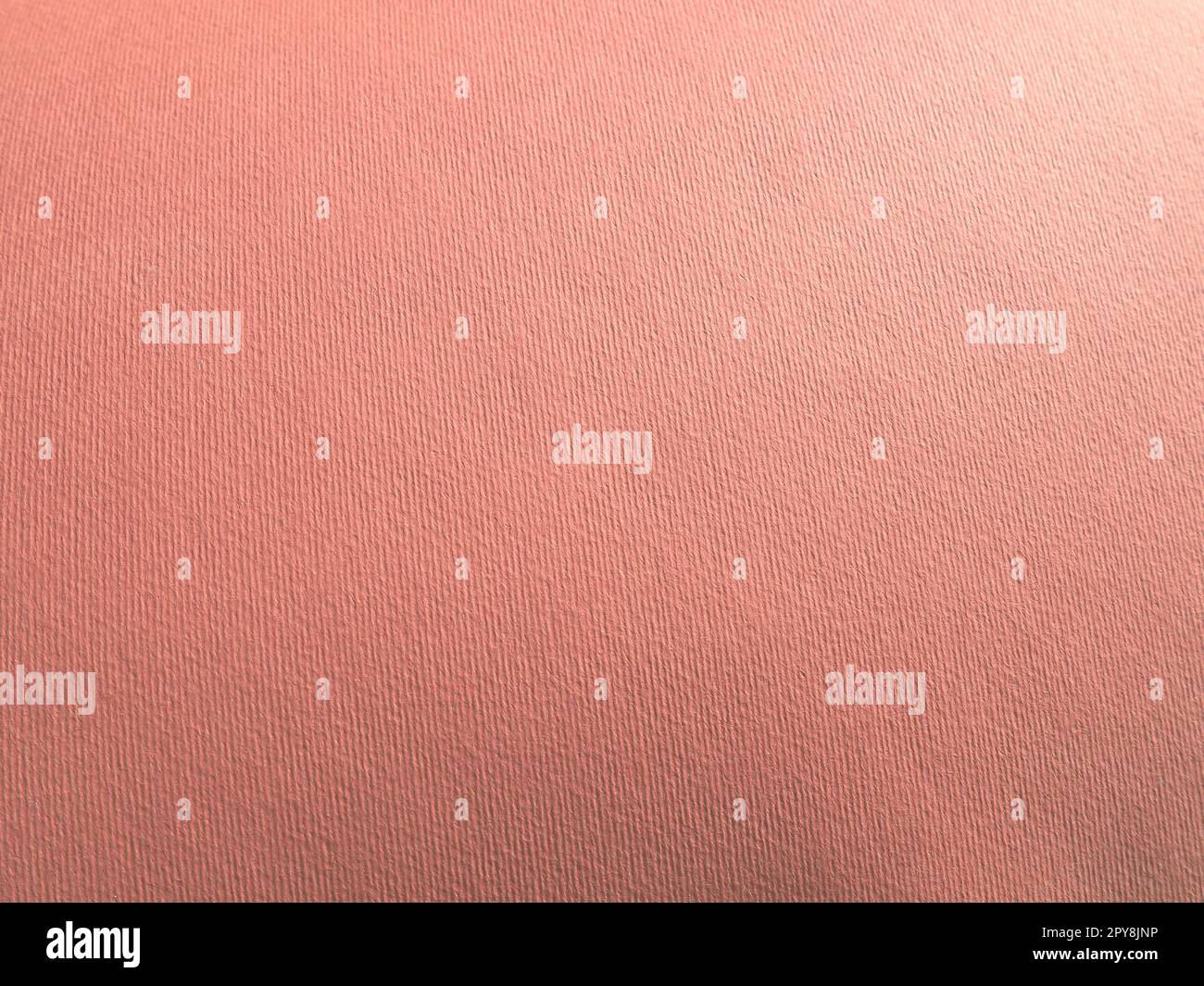 Fondo rosa abstracto con textura. Primer plano de la superficie del papel con gradiente de color y luz. Iluminación lateral. Suave melocotón pastel o fondo de tono rubí. Foto de stock