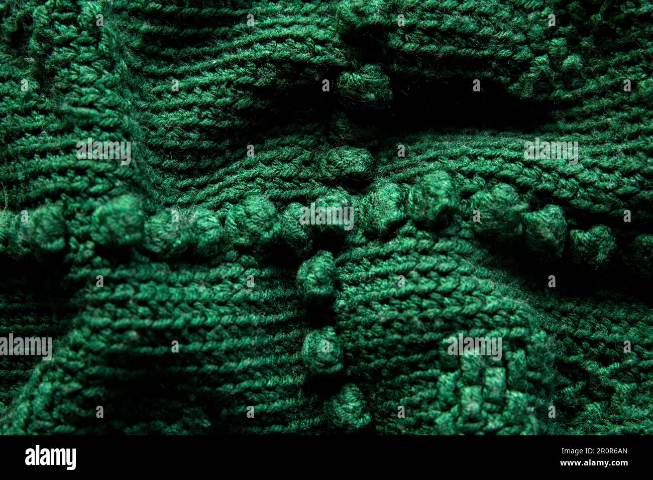close-up textura de ganchillo verde o manta de punto, fondo Foto de stock