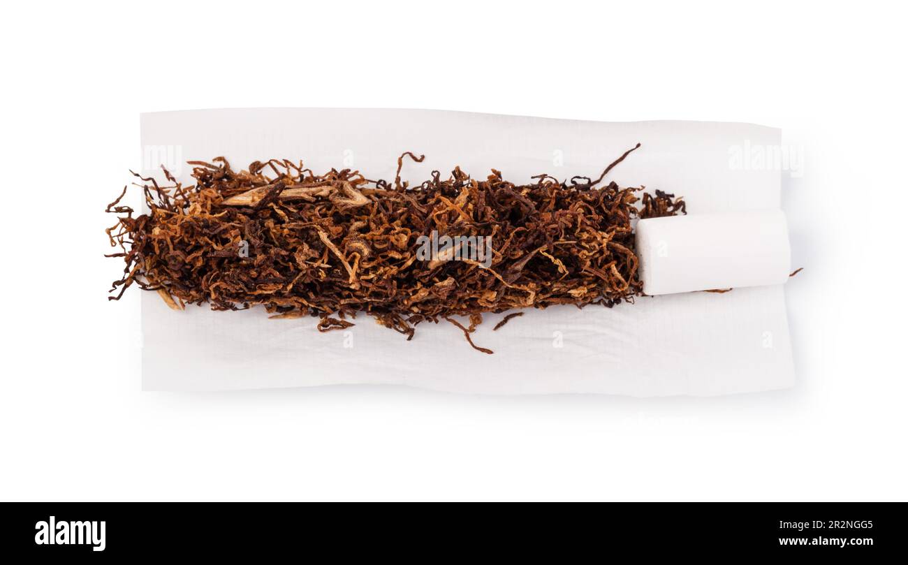 Mano el tabaco de liar, papel y filtros para hacer los cigarrillos en  madera rústica Fotografía de stock - Alamy