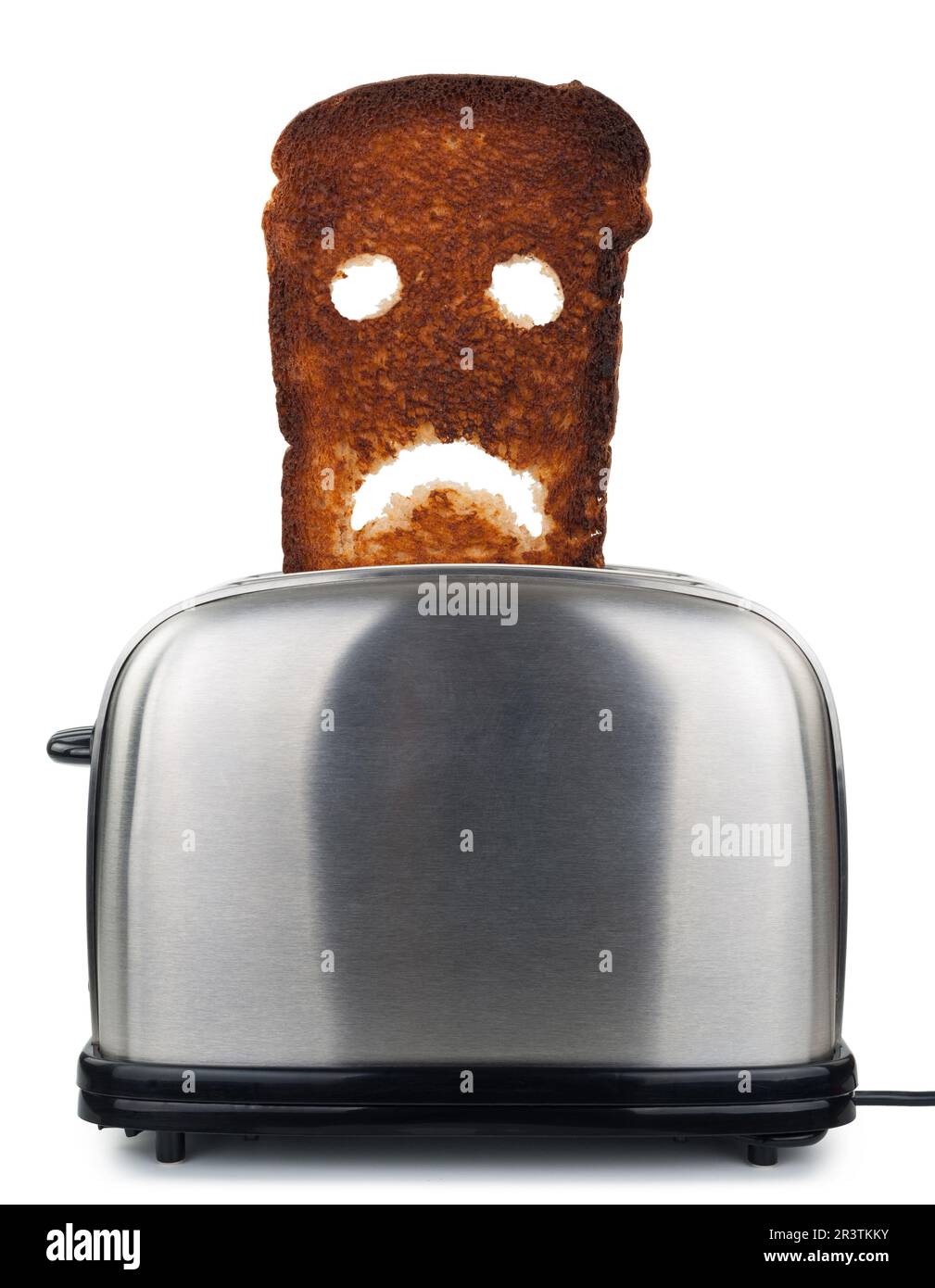 Pan tostado quemado en una tostadora Fotografía de stock - Alamy