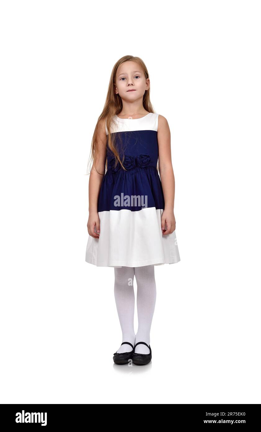 Linda chica joven en vestido azul sobre fondo blanco Foto de stock