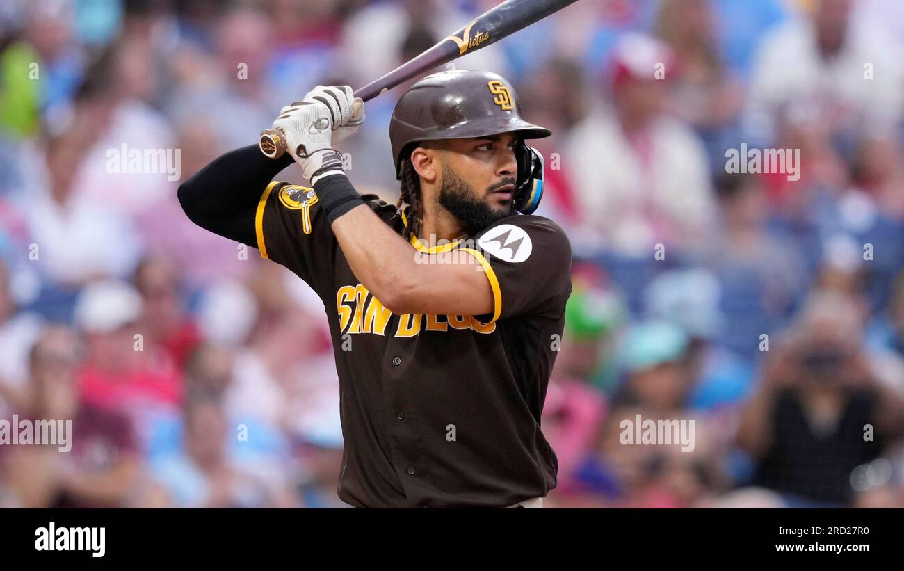 San Diego Padres' Fernando Tatis Jr. wears pink cleats as he stands on  first base after drawing a walk during the first inning of a baseball game  against the San Francisco Giants