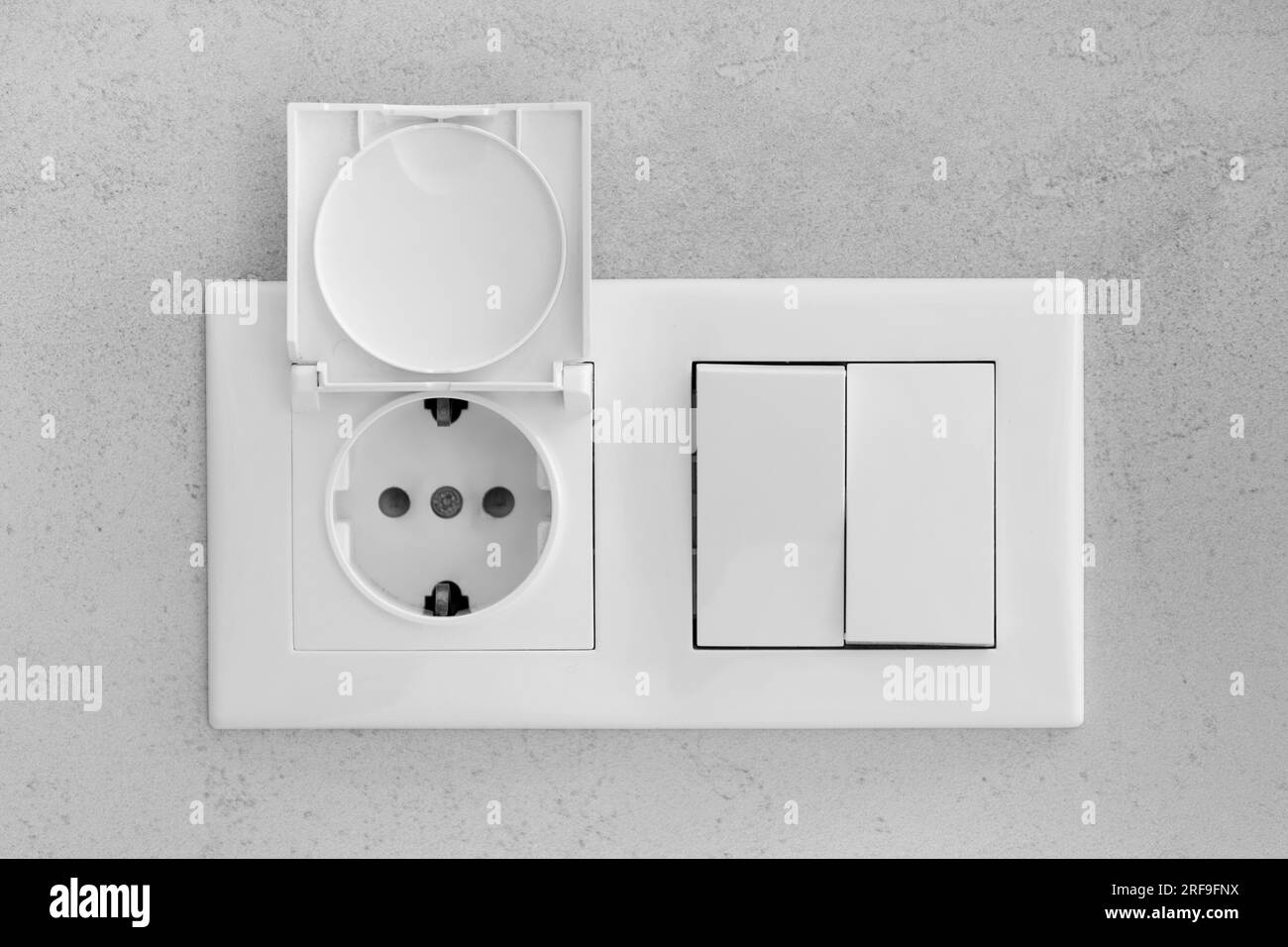 Interruptores De La Luz Blancos Sobre Una Pared Gris Foto de archivo -  Imagen de gente, potencia: 58063344
