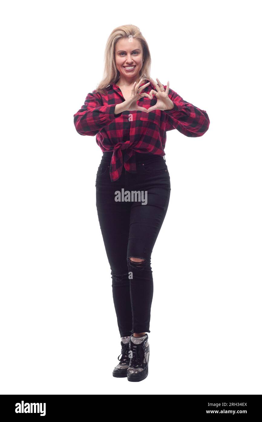 Close-up de joven mujer vistiendo la camisa azul y pantalones negros  ajustados de pie sobre fondo blanco Fotografía de stock - Alamy