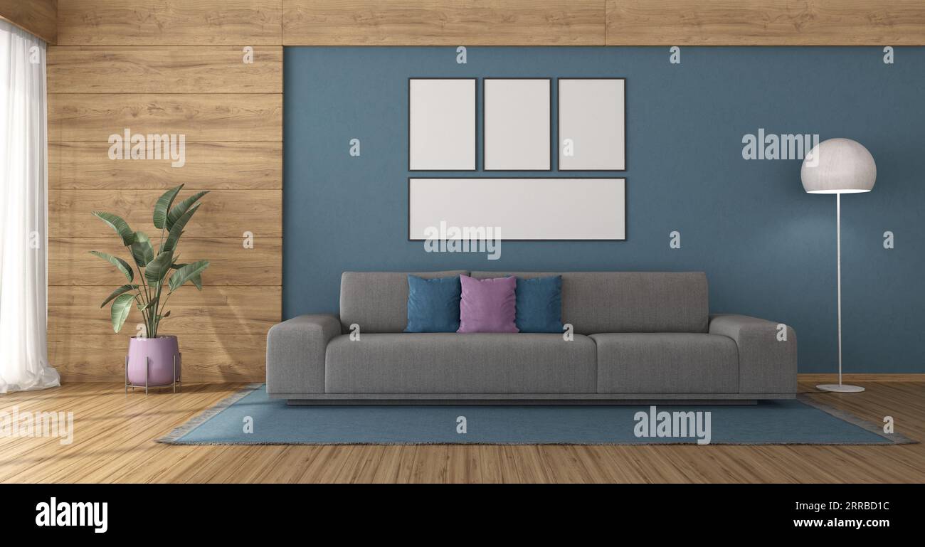 Moderna sala de estar con un gran sofá contra la pared azul y paneles de madera - representación 3D Foto de stock