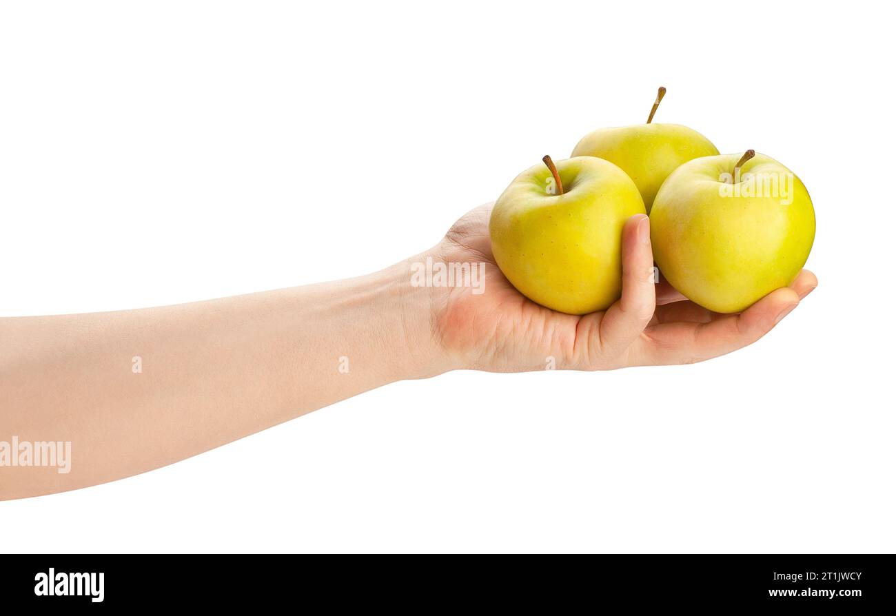 manzana en camino de la mano aislado en blanco Foto de stock