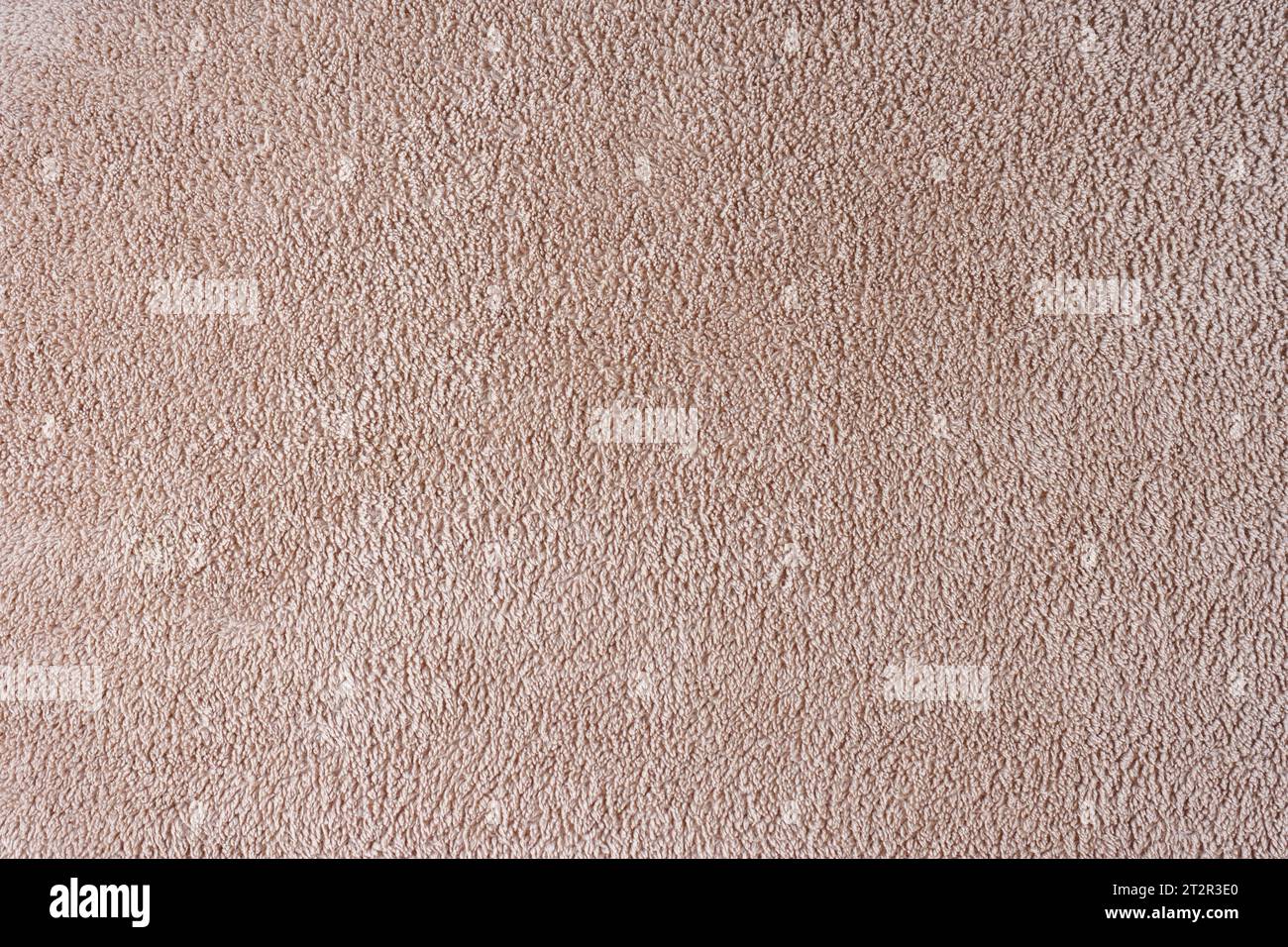 Paño de Terry, toalla beige textura de fondo. Suave suave suave tela de baño o toalla de playa material. Vista superior, primer plano. Foto de stock